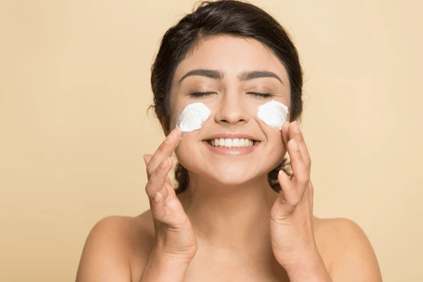 satisfied-indian-lady-applying-cleansing